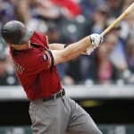 Arizona Diamondbacks' Paul Goldschmidt follows through with his swing after connecting for an RBI-double off Colorado Rockies starting pitcher Chad Bettis in the sixth inning of a baseball game Wednesday, May 11, 2016, in Denver. (AP Photo/David Zalubowski)