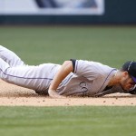 Colorado Rockies' Nolan Arenado dives for but is unable to come up with a ground ball hit by Arizona Diamondbacks' Chris Herrmann during the sixth inning of a baseball game Sunday, May 1, 2016, in Phoenix. (AP Photo/Ross D. Franklin)