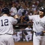 New York Yankees' Starlin Castro, right, celebrates his home run against the Arizona Diamondbacks with Chase Headley (12) during the second inning of a baseball game Tuesday, May 17, 2016, in Phoenix. (AP Photo/Ross D. Franklin)