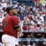 Arizona Diamondbacks' Yasmany Tomas grimaces after striking out against the Colorado Rockies during the seventh inning of a baseball game, Sunday, May 1, 2016, in Phoenix. The Rockies defeated the Diamondbacks 6-3. (AP Photo/Ross D. Franklin)