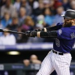 Colorado Rockies' Charlie Blackmon connects for an RBI-sacrifice fly off Arizona Diamondbacks starting pitcher Archie Bradley in the fourth inning of a baseball game Monday, May 9, 2016, in Denver. (AP Photo/David Zalubowski)
