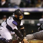 Colorado Rockies catcher Tony Wolters, tags out Arizona Diamondbacks' Yasmany Tomas at home plate as he tries to score on a single hit by Chris Owings in the fourth inning of a baseball game Tuesday, May 10, 2016, in Denver. (AP Photo/David Zalubowski)