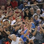 Fans show a variety of reactions after San Diego Padres' Derek Norris lost control of his bat and it flew toward the stands during the fifth inning of the Padres' baseball game against the Arizona Diamondbacks on Saturday, May 28, 2016, in Phoenix. (AP Photo/Ross D. Franklin)