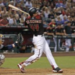 Arizona Diamondbacks' Paul Goldschmidt watches his two-run home run in front of San Diego Padres' Derek Norris during the second inning of a baseball game Saturday, May 28, 2016, in Phoenix. (AP Photo/Ross D. Franklin)