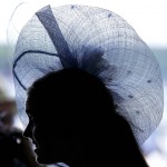 A woman wears a hat before the 142nd running of the Kentucky Derby horse race at Churchill Downs Saturday, May 7, 2016, in Louisville, Ky. (AP Photo/Darron Cummings)