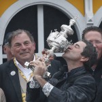 Trainer Keith Desormeaux kisses a trophy after Exaggerator with Kent Desormeaux atop won the 141st Preakness Stakes horse race at Pimlico Race Course, Saturday, May 21, 2016, in Baltimore.(AP Photo/Matt Slocum)