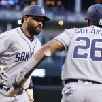 San Diego Padres' Matt Kemp, left, celebrates his home run against the Arizona Diamondbacks with Yangervis Solarte (26) during the first inning of a baseball game Saturday, May 28, 2016, in Phoenix. (AP Photo/Ross D. Franklin)