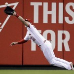 St. Louis Cardinals center fielder Jeremy Hazelbaker dives to catch a ball hit by Arizona Diamondbacks' Brandon Drury during the first inning of a baseball game Friday, May 20, 2016, in St. Louis. (AP Photo/Jeff Roberson)