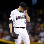Arizona Diamondbacks starting pitcher Patrick Corbin (46) adjusts his cap before being removed from the game against the Houston Astros during the fourth inning of a baseball game, Tuesday, May 31, 2016, in Phoenix. (AP Photo/Matt York)