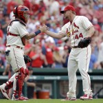 St. Louis Cardinals relief pitcher Trevor Rosenthal, right, and catcher Yadier Molina celebrate following a victory over the Arizona Diamondbacks in a baseball game Saturday, May 21, 2016, in St. Louis. (AP Photo/Jeff Roberson)