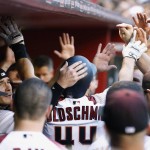 Arizona Diamondbacks' Paul Goldschmidt is congratulated by teammates after hitting a home run against the New York Yankees during the first inning of a baseball game, Monday, May 16, 2016, in Phoenix. (AP Photo/Ross D. Franklin)