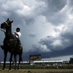 Storm clouds form before the 142nd running of the Kentucky Derby horse race at Churchill Downs Saturday, May 7, 2016, in Louisville, Ky. (AP Photo/Darron Cummings)