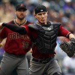 Arizona Diamondbacks catcher Chris Herrmann throws to first base to put out Colorado Rockies' Chad Bettis after he put down a sacrifice bunt in the fourth inning of a baseball game Wednesday, May 11, 2016, in Denver. (AP Photo/David Zalubowski)