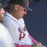 Atlanta Braves manager Fredi Gonzalez works in the dugout during the seventh inning of inning of a baseball game against the Arizona Diamondbacks, Sunday, May 8, 2016, in Atlanta. (AP Photo/John Amis)