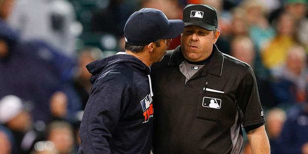 Detroit Tigers manager Brad Ausmus, left, yells at home plate umpire Jeff Nelson against the Minnes...