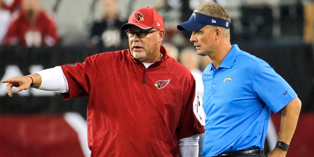 Arizona Cardinals head coach Bruce Arians, left, and San Diego Chargers head coach Mike McCoy talk ...