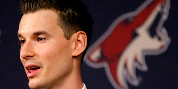 Newly appointed Arizona Coyotes general manager John Chayka speaks at a news conference announcing ...