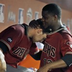 Arizona Diamondbacks left fielder Brandon Drury, left, is hugged by starting pitcher Rubby De La Rosa (12) during the sixth inning of a baseball game against the Miami Marlins, Wednesday, May 4, 2016, in Miami. The Marlins defeated the Diamondbacks 4-3. (AP Photo/Lynne Sladky)