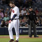 Atlanta Braves' A.J. Pierzynski, left, walks to the dugout after being ejected by home plate umpire Cory Blaser, right, in the fifth inning of a baseball game against the Arizona Diamondbacks Friday, May 6, 2016, in Atlanta. (AP Photo/David Goldman)