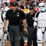 The umpire crew, lead by home plate umpire Jerry Layne, middle, is escorted to the plate by Star Wars character Stormtroopers on Star Wars Night at Chase Field prior to a baseball game between the Arizona Diamondbacks and the San Francisco Giants Saturday, May 14, 2016, in Phoenix. (AP Photo/Ross D. Franklin)