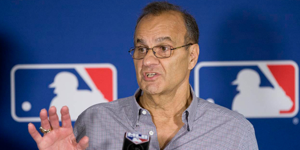 Major League Baseball executive Joe Torre gestures as he speaks during a news conference at the gen...