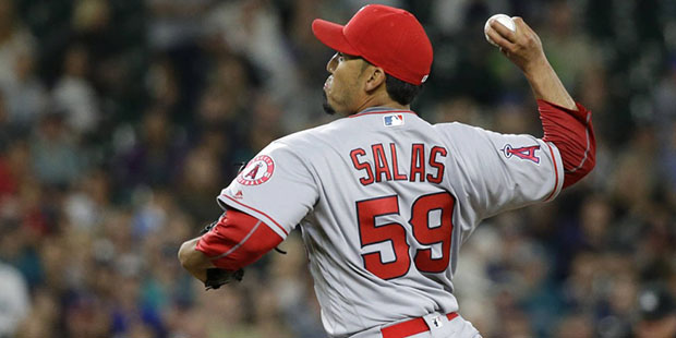 Los Angeles Angels' Fernando Salas throws against the Seattle Mariners in the ninth inning of a bas...