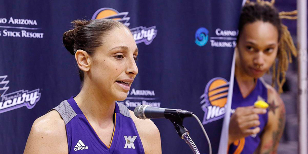 Phoenix Mercury's Diana Taurasi, left, speaks during a news conference at the team's basketball med...