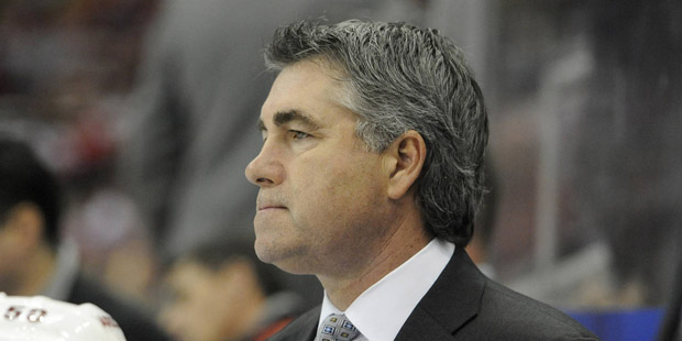 Arizona Coyotes head coach Dave Tippett watches his team play the Detroit Red Wings during the seco...