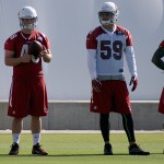 Punter Drew Butler, long-snapper Daniel Dillon, linebacker Alani Fua and safety Marqui Christian watch during Cardinals mini-camp Wednesday, June 8. (Photo by Adam Green/Arizona Sports)