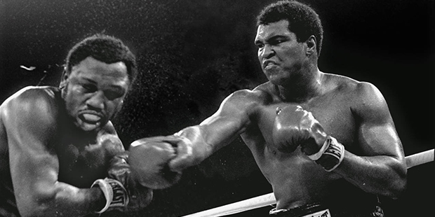 FILE - In this Oct. 1, 1975, file photo, heavyweight champion Muhammad Ali connects with a right to...