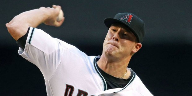Arizona Diamondbacks' Archie Bradley throws a pitch during the first inning of a baseball game agai...