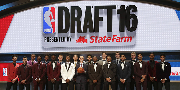 Prospective NBA draft picks pose for a group photo with NBA Commissioner Adam Silver, center, befor...