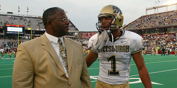 Pittsburgh receiver Larry Fitzgerald shares a moment with his father Larry, Sr., after Fitzgerald broke an NCAA record with his 14th consecutive game with a touchdown reception during Pitt's 24-13 win over Boston College at Alumni Stadium in Boston Saturday, Nov. 1, 2003. (AP Photo/Winslow Townson)