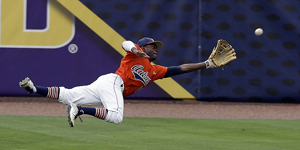 Auburn’s Anfernee Grier (10) dives and catches a fly ball during the second inning of a game agai...