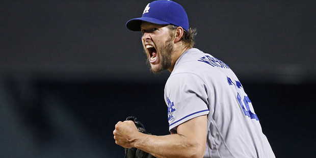Los Angeles Dodgers' Clayton Kershaw shouts and pumps his fist after striking out Arizona Diamondba...