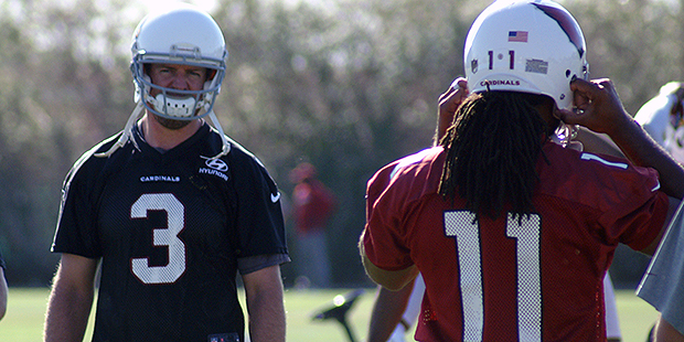 QB Carson Palmer looks at WR Larry Fitzgerald during an OTA practice. (Photo by Adam Green/Arizona ...