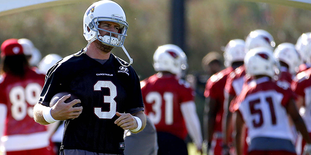 Arizona Cardinals' quarterback Carson Palmer runs drills  during NFL football practice, Tuesday, Ma...