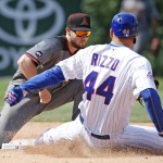 Arizona Diamondbacks shortstop Chris Owings, left, tags out Chicago Cubs' Anthony Rizzo during the eighth inning of a baseball game Friday, June 3, 2016, in Chicago. (AP Photo/Nam Y. Huh)