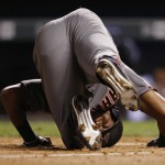 Arizona Diamondbacks' Socrates Brito reacts as he falls in the batter's box after fouling off a pitch from Colorado Rockies relief pitcher Justin Miller in the eighth inning of a baseball game Thursday, June 23, 2016, in Denver. The Diamondbacks won 7-6. (AP Photo/David Zalubowski)