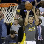 Golden State Warriors guard Stephen Curry warm up before Game 2 of basketball's NBA Finals between the Warriors and the Cleveland Cavaliers in Oakland, Calif., Sunday, June 5, 2016. (AP Photo/Marcio Jose Sanchez)