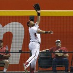 Arizona Diamondbacks left fielder Yasmany Tomas makes the leaping catch for the out on a ball hit by Tampa Bay Rays Logan Morrison in the first inning during a baseball game, Wednesday, June 8, 2016, in Phoenix. (AP Photo/Rick Scuteri)