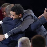 Jamal Murray hugs a supporter after being selected seventh overall by the Denver Nuggets during the NBA basketball draft, Thursday, June 23, 2016, in New York. (AP Photo/Frank Franklin II)
