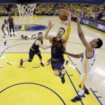 Cleveland Cavaliers' Matthew Dellavedova (8) drives past Golden State Warriors' Shaun Livingston, right, during the first half in Game 1 of basketball's NBA Finals Thursday, June 2, 2016, in Oakland, Calif. (AP Photo/Marcio Jose Sanchez, Pool)