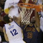 Golden State Warriors center Andrew Bogut (12) blocks a shot by Cleveland Cavaliers center Tristan Thompson (13) during the first half of Game 2 of basketball's NBA Finals in Oakland, Calif., Sunday, June 5, 2016. (AP Photo/Ben Margot)
