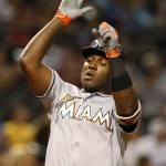 Miami Marlins Marcell Ozuna gestures after hitting a solo home run during the eighth inning of a baseball game against the Arizona Diamondbacks, Saturday, June 11, 2016, in Phoenix. (AP Photo/Rick Scuteri)