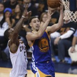Golden State Warriors guard Klay Thompson (11) drives on Cleveland Cavaliers guard J.R. Smith (5) during the second half of Game 6 of basketball's NBA Finals in Cleveland, Thursday, June 16, 2016. (AP Photo/Ron Schwane)