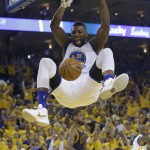 Golden State Warriors center Festus Ezeli (31) dunks against the Cleveland Cavaliers during the first half of Game 1 of basketball's NBA Finals in Oakland, Calif., Thursday, June 2, 2016. (AP Photo/Marcio Jose Sanchez)