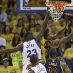 Cleveland Cavaliers center Tristan Thompson, right, shoots against Golden State Warriors forward Draymond Green (23) during the first half of Game 1 of basketball's NBA Finals in Oakland, Calif., Thursday, June 2, 2016. (AP Photo/Marcio Jose Sanchez)