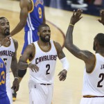 Cleveland Cavaliers forward LeBron James (23) celebrates with Kyrie Irving (2) and J.R. Smith (5) against the Golden State Warriors during the first half of Game 6 of basketball's NBA Finals in Cleveland, Thursday, June 16, 2016. (AP Photo/Ron Schwane)