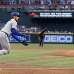 Los Angeles Dodgers' Trayce Thompson, left, tosses his bat after a walk against Arizona Diamondbacks pitcher Zack Greinke, right, during the first inning of a baseball game Monday, June 13, 2016, in Phoenix. (AP Photo/Ross D. Franklin)